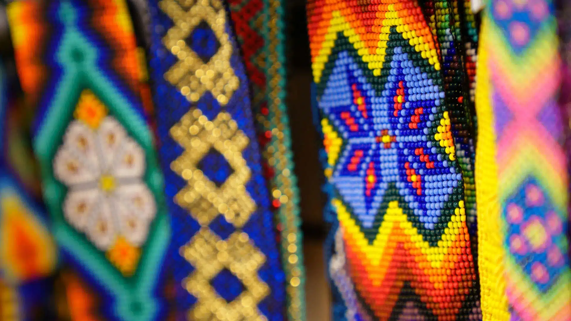 Vibrant indigenous beadwork in focus.