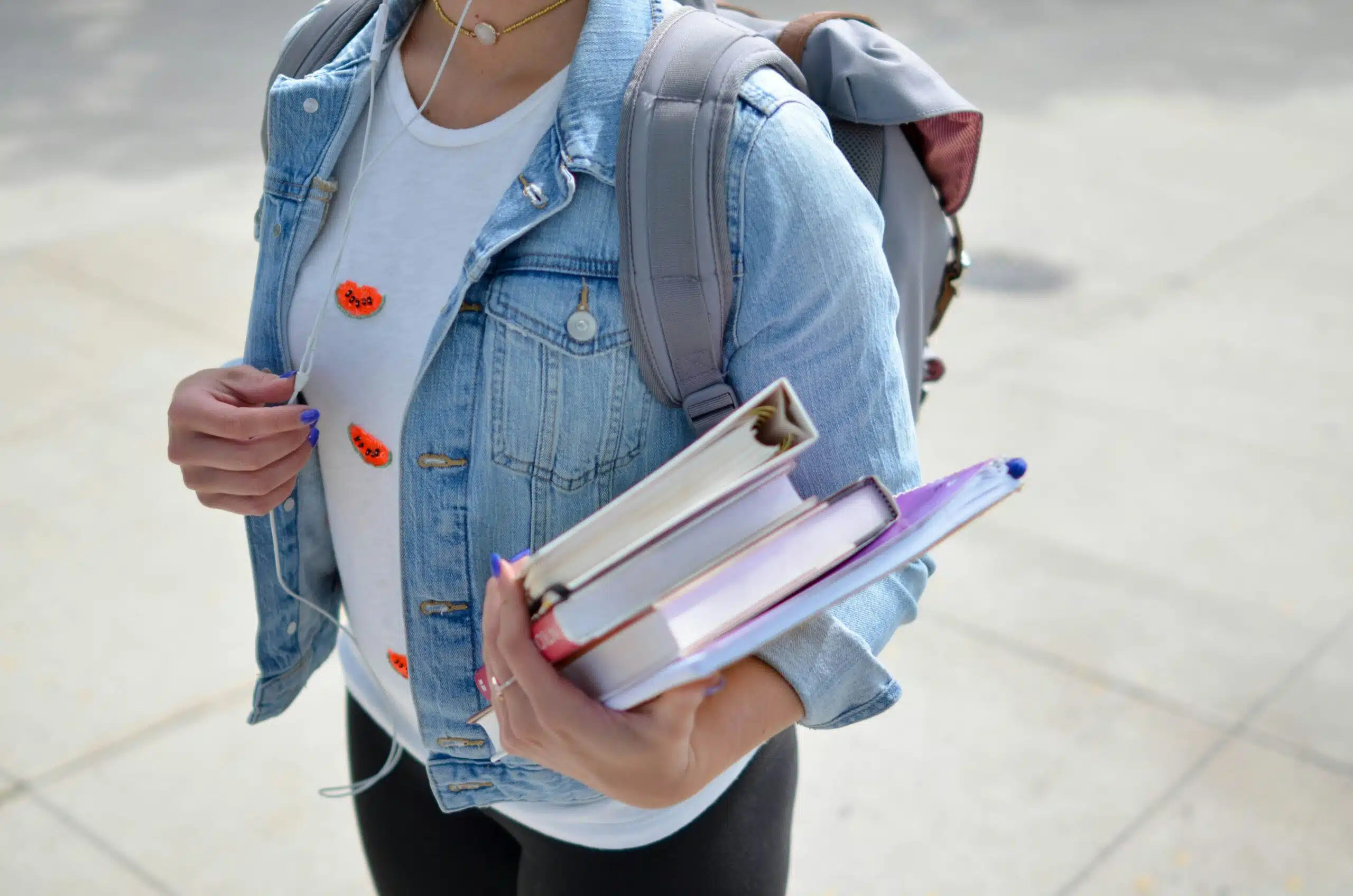 Student holding educational material.